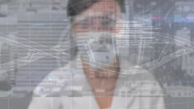Laboratuvarda, sağlık uzmanı dijital veri animasyonu kaplamalı maske takıyor. technology, innovation, research, science, analysis, protection
