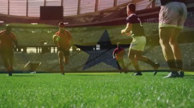 Rugby oyuncuları stadyumda Gana bayrağı animasyonuyla sahada mücadele ediyorlar. Spor, rekabet, takım çalışması, eylem, sporcular, ulusal bayrak