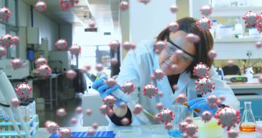Laboratuvarda pipet ve test tüpleriyle COVID-19 araştırması yapan bir bilim adamı. Bilim, salgın, viroloji, test, deney, sağlık