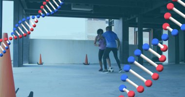 Futbol oynayan erkek ve kadının üzerinde dönen iki DNA örneği. Dijital arayüz küresel spor ve performans konsepti dijital olarak oluşturulmuş görüntü.