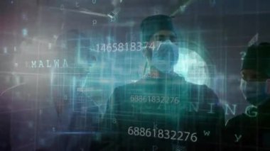 Hastanede, tıbbi uzmanlar tıbbi giysiler içinde dijital veri animasyonunu analiz ediyorlar. Sağlık, ameliyat, analiz, doktor, ekip çalışması, araştırma