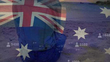 Avustralya bayrağı ve veri işleme animasyon örtüsüyle sahilde olan kişi. Vatanseverlik, teknoloji, kutlama
