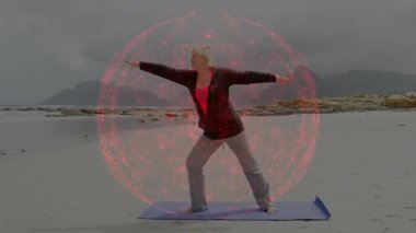 Sahilde yoga yapan bir insan ve onları çevreleyen parlak kırmızı küre animasyonu. Meditasyon, sükunet, farkındalık, rahatlama, dinginlik, maneviyat