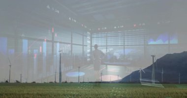 Sahnede rüzgar türbinleri ve finansal veri işleme animasyonları manzarayı örtüyor. Sürdürülebilir, yenilenebilir, enerji, yenilik, teknoloji, yatırım