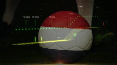 Finansal veriler ve grafikler üzerinde kırmızı ve beyaz desenli futbol topu. Finans, spor, yatırım, ekonomi, analiz, borsa