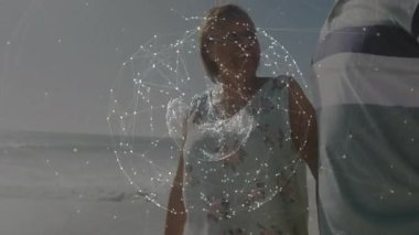 Sahilde yürüyen bir çift. Bağlantılar, animasyon ağları var. Teknoloji, ağ, dijital, iletişim, fütüristik