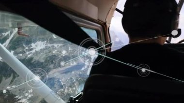 Pilot ve yardımcı pilot şebeke bağlantıları olan uçakları hareket ettiriyor. Havacılık, teknoloji, kokpit, navigasyon, takım çalışması, iletişim