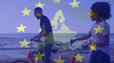 Deniz kenarında bisiklet süren, Avrupa Birliği yıldızlı iki kişi animasyon yapıyor. Bisiklet, eğlence, açık hava, macera, özgürlük, seyahat