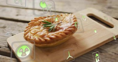 Çevre dostu ikonlar ahşap bir tahtanın üzerinde turtanın etrafında yüzüyor, animasyon yaratıyorlar. sürdürülebilirlik, organik, çevre, aşçılık, yeşil, karbon ayak izi