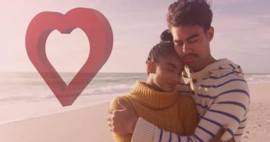 Sahilde kucaklaşan ve okyanus arka planında kalp animasyonu olan bir çift. Romantizm, aşk, birliktelik, günbatımı