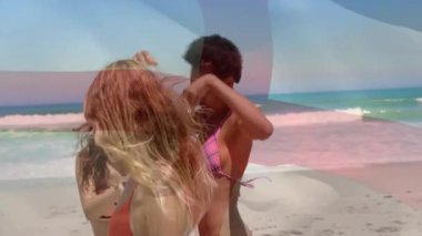 Okyanus dalgalarıyla sahilde neşeyle dans eden kadınlar canlı animasyonlar yaratıyor. Dans, eğlence, eğlence, kutlama, yaz, arkadaşlık