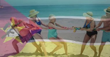 Sahilde halat çekme oyunu, renkli bayrak animasyonuyla ip çekme oyunu. rekabet, takım çalışması, spor, yaz, oyun, eğlence