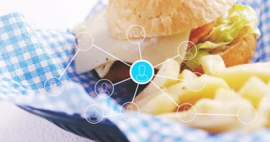 Restoran ortamında canlı ağ bağlantıları olan hamburger ve patates kızartması. Fast food, teknoloji, yenilik, dijital, ağ