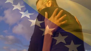 Animasyon arka planında Bosna-Hersek bayrağıyla kucaklaşan çift. Romantizm, vatanseverlik, ilişki, aşk, animasyon, kutlama