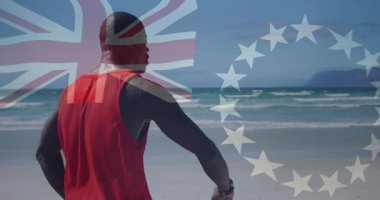 Sahilde kırmızı kolsuz tişörtlü, bayrak kaplama animasyonlu bir adam. Yaz, okyanus, yaşam tarzı, açık hava