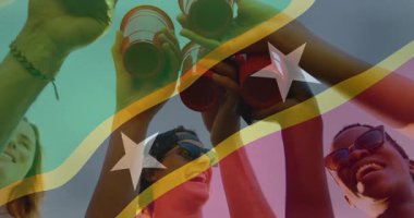 St. Kitts ve Nevis bayrak animasyonlu kırmızı bardakları okul etkinliğinde tutmak. Kutlama, çeşitlilik, kültür, eğitim, okul ruhu, birlik