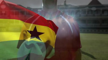 Spor sahasında ragbi topu tutan, Gana bayrağı sallayan kişi. atlet, yarışma, takım çalışması, Afrikalı, kutlama, ulusal