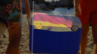 Sahilde Alman bayrağı taşıyan insanlar animasyon yapıyor. Yaz, tatil, seyahat, rahatlama, sahil şeridi, boş zaman