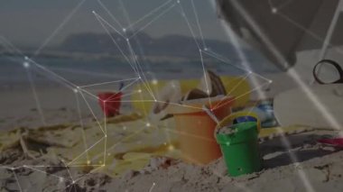 Kumsaldaki oyuncaklar ve havlularla ağ bağlantıları animasyon örtüsü. Yaz, rahatlama, tatil, ağ, dijital, teknoloji