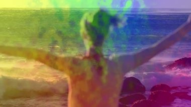 Kolları okyanus tarafından renkli soyut animasyonların üzerine açılmış biri. Özgürlük, sükunet, yaratıcılık, ifade, canlılık, ilham