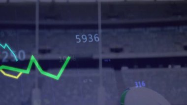 Rugby topu sahada, finansal veri grafiği ve yüzdeleri animasyonuyla birlikte. finans, spor, analitik, yatırım, veri analizi, istatistik