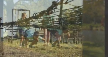 Engel parkurunda gezinen insanlar, etraflarını çevreleyen ağaçlar ve çimenler. Macera, takım çalışması, mücadele, doğa, fitness, aktivite