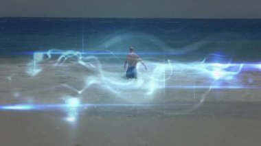 Okyanus dalgalarının içinde, ışıldayan ışık efektleriyle çevrili bir adam. Plaj, su, yaratıcılık, dijital
