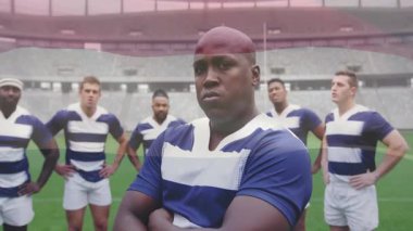 Sahada güven içinde duran rugby takımı animasyon bayrağını üstüste dikti. Spor, takım çalışması, rekabet, zafer, birlik, kutlama