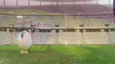 Rugby oyuncusu kalabalık animasyonuyla stadyum sahasında topa vurmaya hazırlanıyor. Spor, yarışma, atlet, takım, şampiyonluk, aksiyon