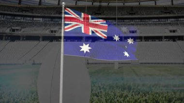 Boş stadyumun üzerinde yeşil çayırlı ve koltuklu Avustralya bayrağı sallıyordu. Spor, ulusal, etkinlik, vatanseverlik, açık hava, kutlama