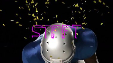 Mavi formalı Amerikalı futbolcu konfeti ve animasyonla kutlama yapıyor. Sporcu, touchdown, zafer, kutlama, sportmenlik, şampiyonluk