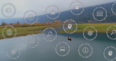 Huzurlu göl manzarasını kaplayan eğitim ve teknoloji simgelerinin canlandırılması. yenilik, dijital