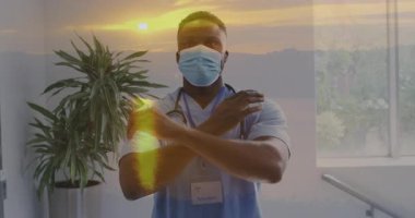 Maske ve önlük takan, arka planda günbatımı animasyonu olan bir sağlık uzmanı. tıbbi, güvenlik, koruma