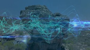 Mavi ve yeşil dijital dalga animasyonu açık gökyüzünün altındaki kayalık arazide. Doğa, teknoloji, fütürist, tarz