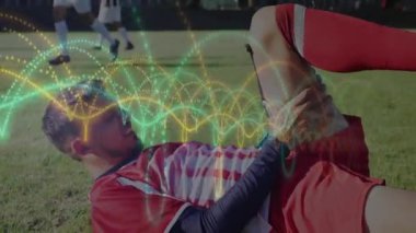 Futbolcu sahada renkli dalga animasyonlarıyla bacağını tutuyor. Spor, futbol, atlet, sakatlık, acı, konsept