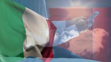 Arka planda İtalyan bayrağı ve gökyüzü animasyonuyla akıllı telefon kullanmak. technology, Italy, national, digital, clouds, communication