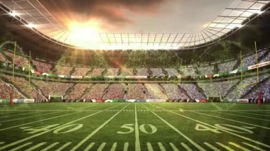 Güneş yemyeşil futbol sahasında canlı bir animasyonla stadyumun üzerinde batıyor. Günbatımı, spor, manzara