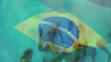 Suyun altında yüzen, Brezilya bayrağı animasyonu olan insanlar canlı sahnelerle örtüşüyor. Dalış, su sporları, atletizm, milli gurur, takım çalışması, kutlama