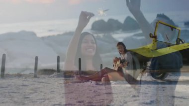 Sahilde gitarla piknik yapan çiftin dans animasyonu. Romantik, yaz, tatil, deniz kenarı, müzik, açık hava