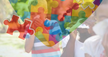 Çocukların burunlarını silmesi üzerine renkli yapboz parçaları. otizm, öğrenme güçlüğü, destek ve farkındalık kavramı dijital olarak oluşturulmuş görüntü.