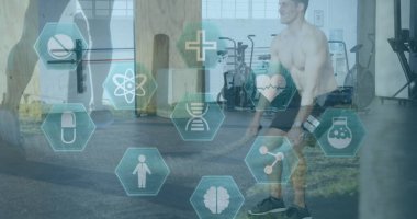 Spor salonunda egzersiz yapan beyaz bir adam üzerinde tıbbi ve sağlık simgeleri. etkin sağlıklı yaşam tarzı ve spor konsepti dijital olarak oluşturulmuş imaj.