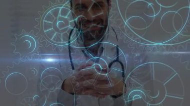 Erkek doktor steteskopla el sıkışıyor, sağlık göstergesi ve holografik dişli ikonları gösteriyor. Tıbbi, yenilik, teknoloji, fütüristik, sağlık, dijital, profesyonel