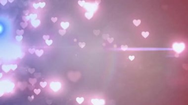 Soyut kalp şeklindeki bokeh kümesi, ışık patlamalarıyla birlikte rüya gibi pastel arka planda canlandırılıyor. Romantik, hayalci, pastel, ruhani, soyut, enerjik, kaprisli