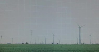 Rüzgâr türbini, şeffaf HUD kaplamaları ve ekin alanı ile düz tasarım ile görselleştiriliyor. Yenilenebilir, sürdürülebilirlik, teknoloji, dijital, çevre, yenilik, temiz enerji