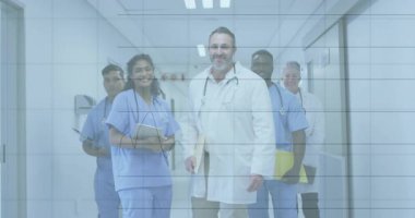 Tıbbi ekip dijital tablet tutuyor, koridorda ayakta hareketli finansal çizelgeleri gösteriyor. Sağlık, ekip, işbirliği, profesyonellik, teknoloji, analiz, yenilik