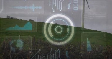 Tepenin yamacında dairesel HUD görüntülenirken, rüzgar türbini dalga biçimi ve grafiği altında yükseliyor. Yenilenebilir enerji, teknoloji, dijital arayüz, çevre, gelecekçilik, sürdürülebilirlik, yenilik