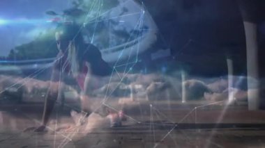 Kadın, spor teknolojisini gösteren parlak çizgiler ve düğümlerle başlangıç pozisyonunda çömeliyor. Atletik, yenilikçi, dinamik, teknoloji, fütürizm, kararlılık, hız