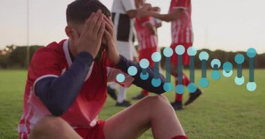 Futbol oyuncusu sahada diz çöküyor ve spor teknolojisi için animasyon performans grafiği örtüyor. Sporcu, takım çalışması, stadyum, canlı, kararlılık, yarışma, açık hava