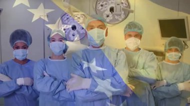 Beş cerrahi ekip üyesi ameliyathanede durmuş, canlandırılmış kalp ikonları ve çizelgeleri sergiliyorlar. Tıp uzmanları, takım çalışması, klinik çevre, sağlık, hassasiyet, işbirliği, steril çevre