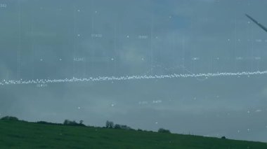 Rüzgâr türbini bulutlu gökyüzünün altında çimenli yamaçta dönüyor. Düz tasarımda veri görselleştirmesi gösteriyor. Yenilenebilir, sürdürülebilirlik, teknoloji, yeşil enerji, veri analizi, yenilik, çevre